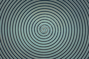 Aluminum metal surface with spiral pattern texture closeup photo background.