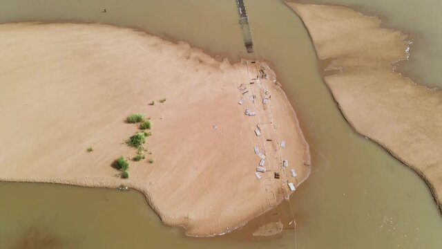 A small bamboo bridge who links the island of Koh Paen to Kampong Cham city under water, Cambodia