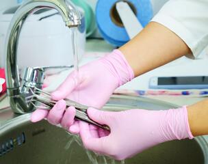 Dental instrument disinfection. Rinse a medical instrument under running water. Disinfection in a medical center, hospital, office. Patient Care The best care for a medical instrument.