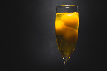 Champagne glass full of raw eggs