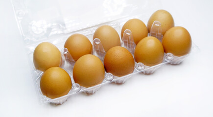 Plastic egg box on a white background.Fresh eggs in a package.