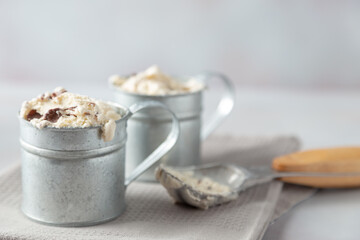 vanilla and chocolate ice cream in aluminium cup