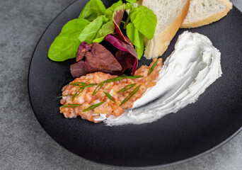 salmon tar-tar decorated with sauce