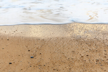 Sandy beach along the Atlantic coast in a summer evening.