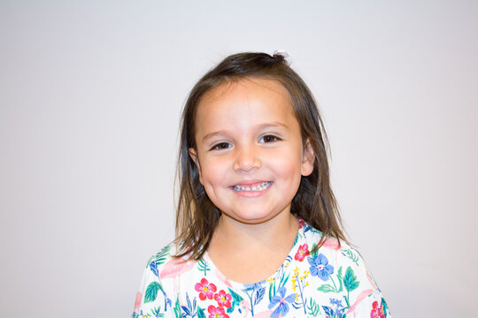 Portrait of a five year old girl making funny faces