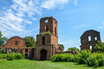 Fototapeta na wymiar Three storey gate tower, adjoining the ruins of the outer walls of the palace buildings of Korets castle, Ukraine