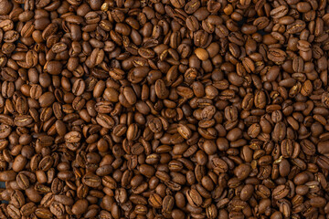 Close-up studio shot of freshly roasted espresso coffee beans.