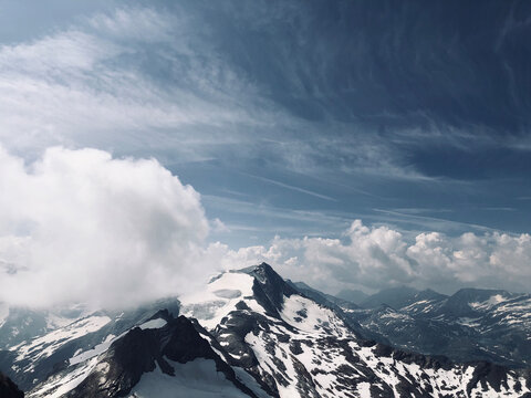 clouds over the snowy mountains