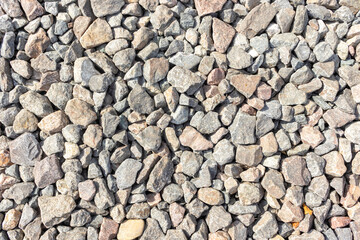 Crushed stone on construction site. Breakstone texture background.