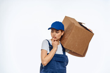 Woman working uniform box in hands packing service light background