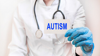 The doctor holds a card with the inscription, medical concept