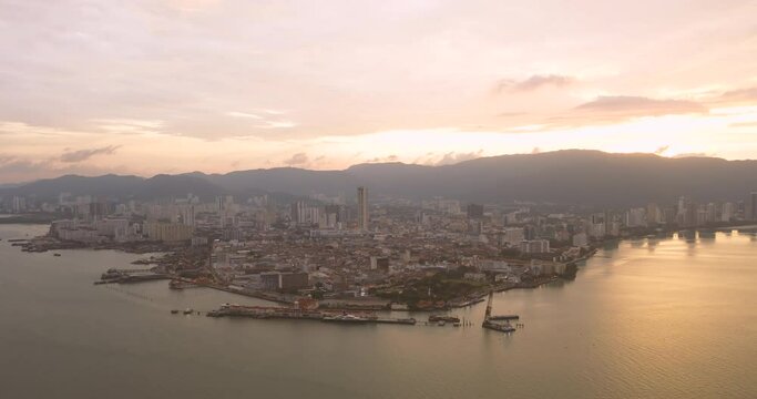 Timelapse: Sunset of Georgetown cityscape during a golden sunset, Penang Island, Malaysia. Cinematic. ProRes 444