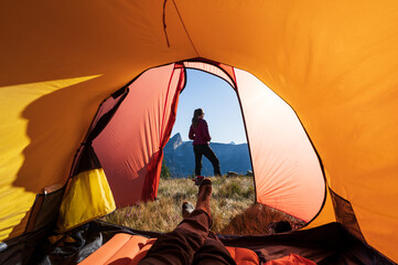 Relaxing at the tent in the mountains during a summers sunrise.