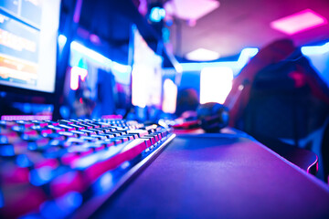 Close-up of cyber sport workplace of professional streamer or online cafe. Neon color blue and pink