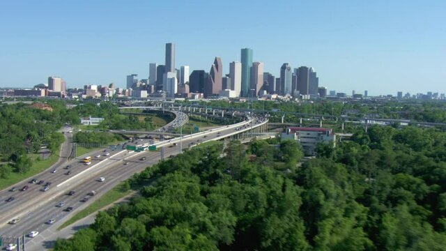 Houston skyline in distance, wide aerial
