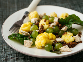 Lentils, Curried Cauliflower with Grapes and home made Vegan Feta Salad