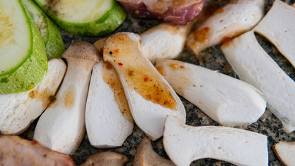 cooking steppe oyster mushrooms, useful eringi mushrooms. Grilling mushrooms on stone
