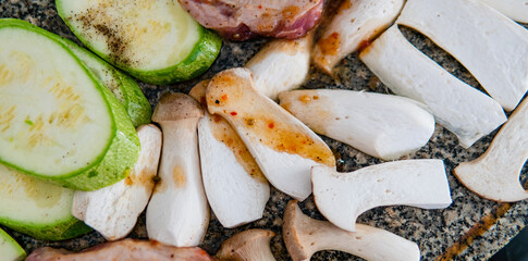 cooking steppe oyster mushrooms, useful eringi mushrooms. Grilling mushrooms on stone