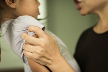 Angry mother yelling at her frightened child. Bad parenting and domestic abuse