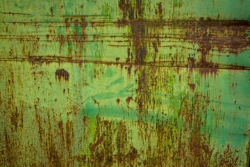rust texture on metal door with green paint