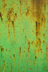 rust texture on metal door with green paint