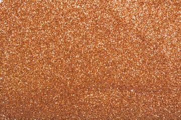 The texture of dry shiny glitter. Bronze bright sparkles.