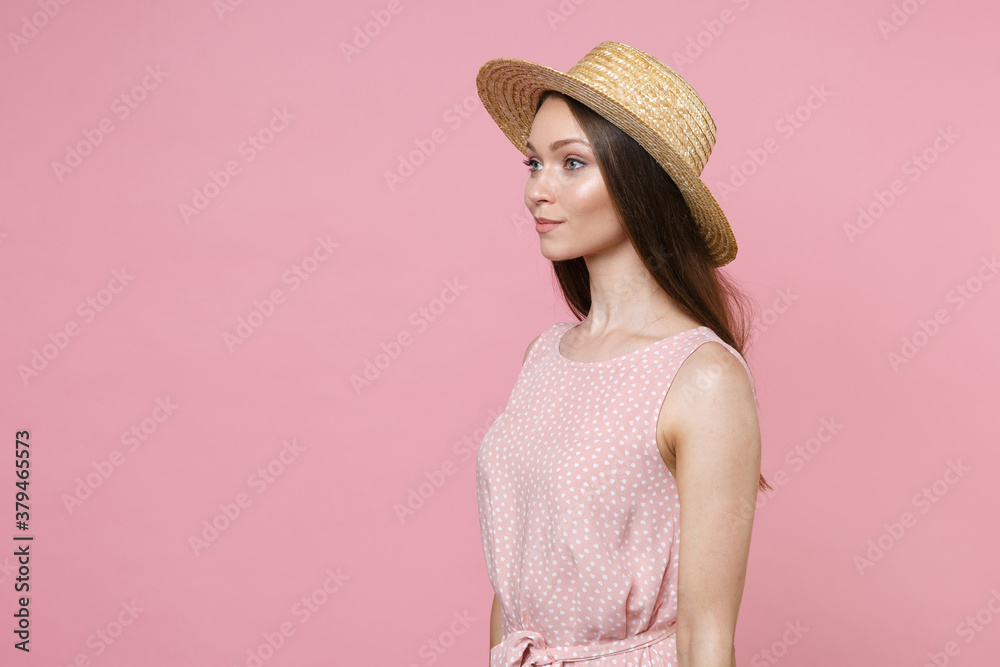 Wall mural side view of smiling beautiful attractive young brunette woman 20s wearing pink summer dotted dress 