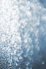 Abstract blurred sparkle bokeh background with glitter lights.