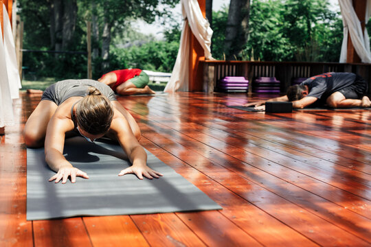Woman in yoga pose during outdoors yoga class