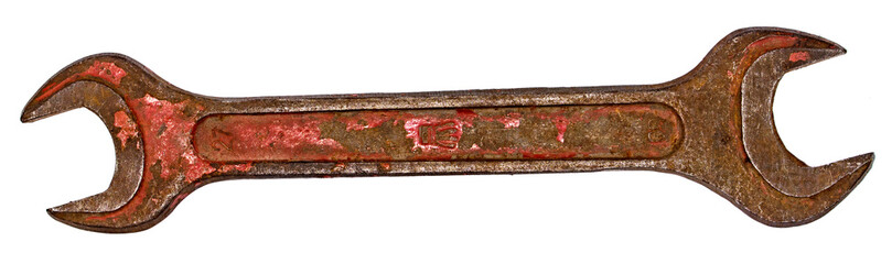 Old wrench on a white background