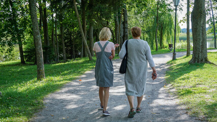Fototapeta premium A group of Mature tourists walking in the Park