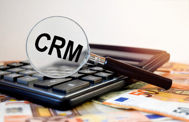 Selling text written on the etching glass, next to the calculator and banknotes.