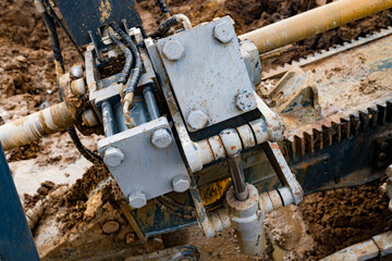 Horizontal directional drilling technology closeup. Drilling machine work process. Trenchless laying of communications, pipes and water pipes