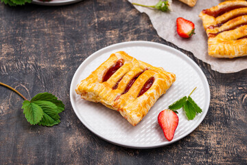 Sweet puff pastry cakes with strawberry