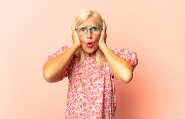 middle age woman looking goofy and funny with a silly cross-eyed expression, joking and fooling...