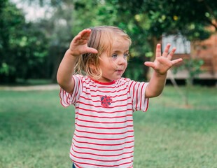 Toddler girl portrait in garden