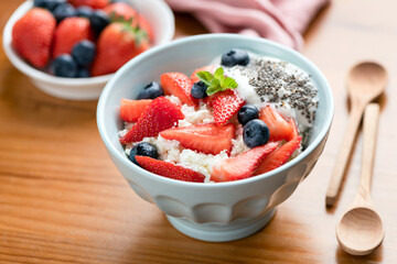 Healthy food bowl ricotta with strawberries and yogurt. Cottage cheese or tvorog