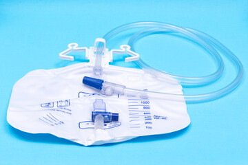 Sterile Urinary Drainage Bag with Anti-Reflux Tower isolated on blue background.