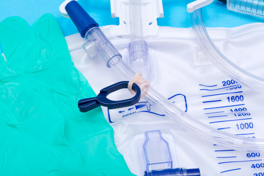 Sterile Urinary Drainage Bag with Anti-Reflux Tower isolated on blue background.