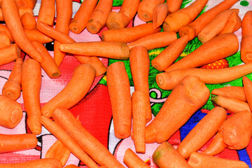 Peeled and washed carrots are ready for processing.