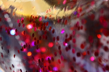 Pool party seen through a life jacket full of glitter