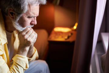 desperate senior man have no meaning to live after death of wife, sick man sit alone, think about something