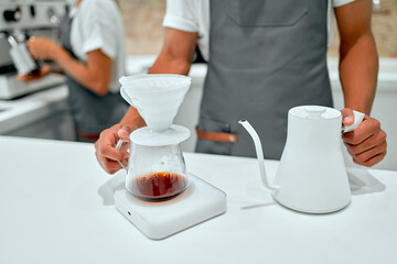 Hand drip coffee, Barista making drip coffee. Barista brewing coffee, method pour over, drip coffee.