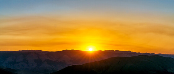 Panorama of Horizon, Sunrise, sunburst, over Mountains