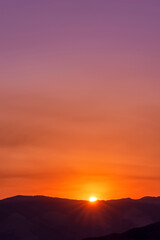 Orange Sunset over Horizon, mountains, silhouette 