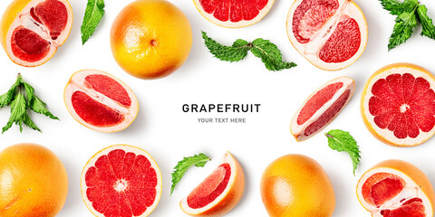 Grapefruit citrus fruits and mint leaves creative layout.