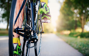 Cyclist riding a bicycle, close up photo. Sport and recreation concept