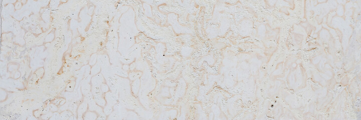 Dolomite texture. Natural rock with beautiful beige patterns on the surface. Polished flat stone. Classic luxury decoration building material. Wide panoramic texture for background and design.