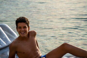 Happy young man on the sea vacation