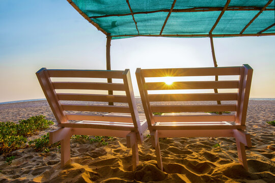 Amazing Sunrise on Nirvana beach in Kumta region : 2  chairs   and sand plus tant